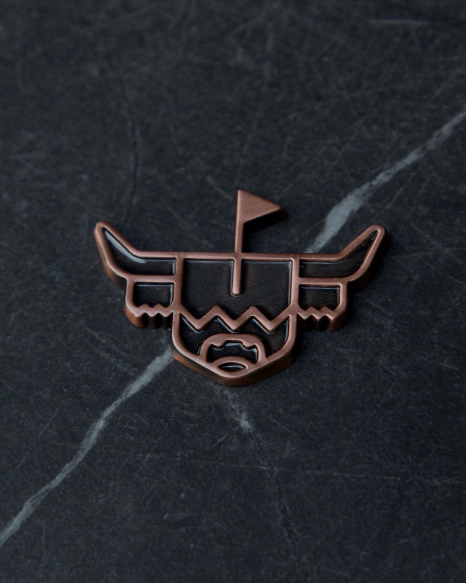 Looper Brass Ball Marker featuring the Highland cattle design on dark stone