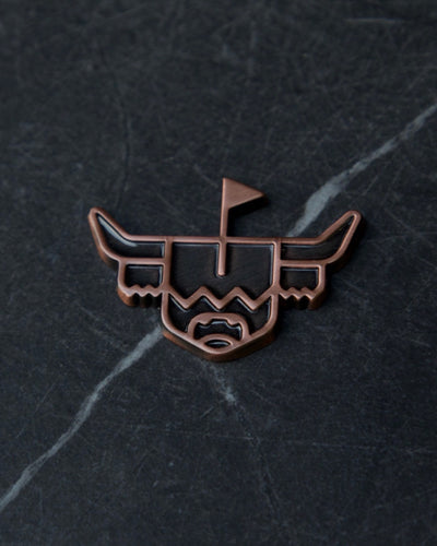 Looper Brass Ball Marker featuring the Highland cattle design on dark stone