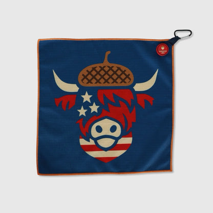 Oakmont 2025 magnetic golf towel featuring Looper Highland cow with acorn and USA flag pattern