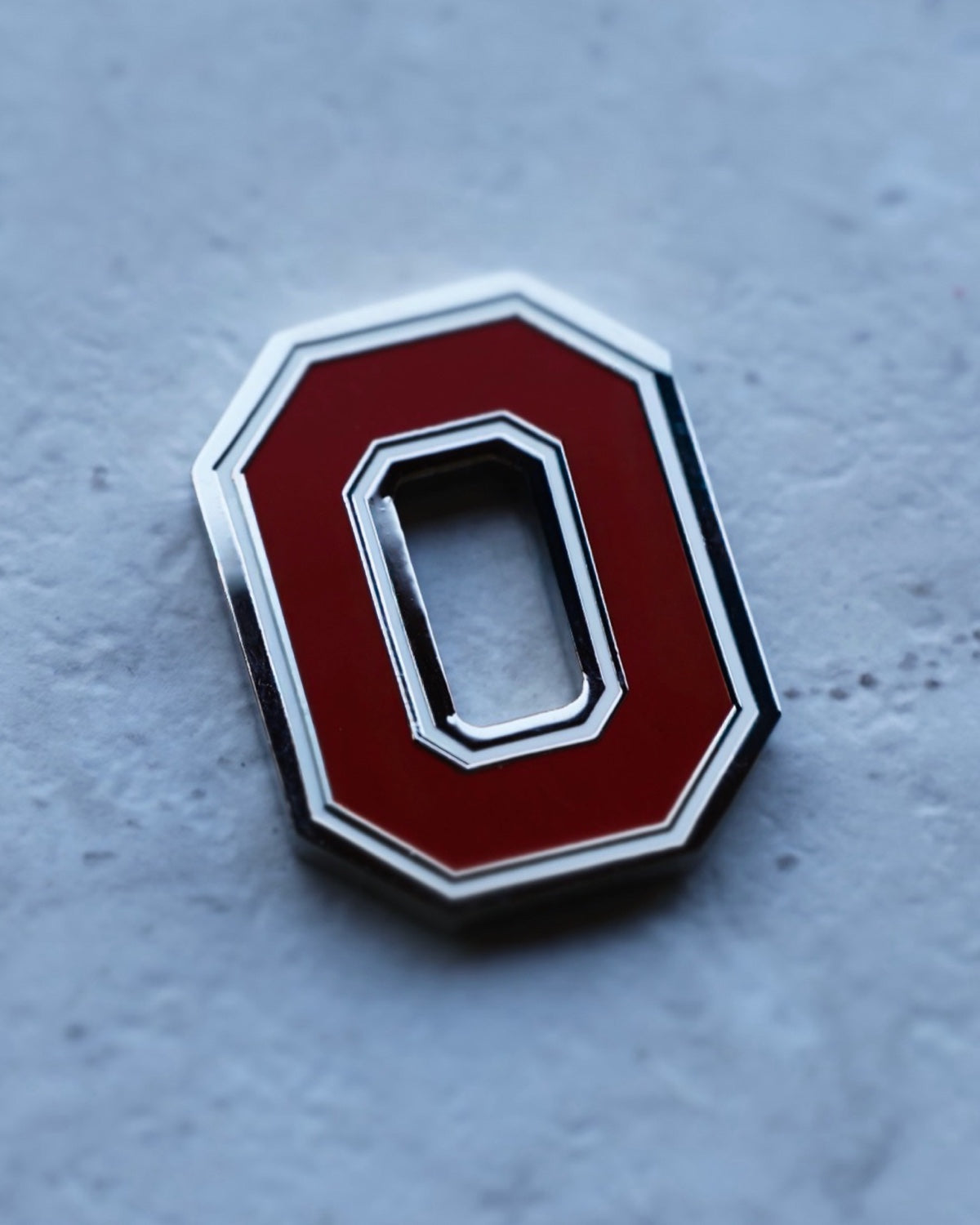 Custom Ohio State Block O golf ball marker designed by Caddy Collective Culture as part of an officially licensed collegiate golf merchandise collection.