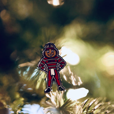 Ohio State Brutus full-body ball marker photographed on holiday greenery