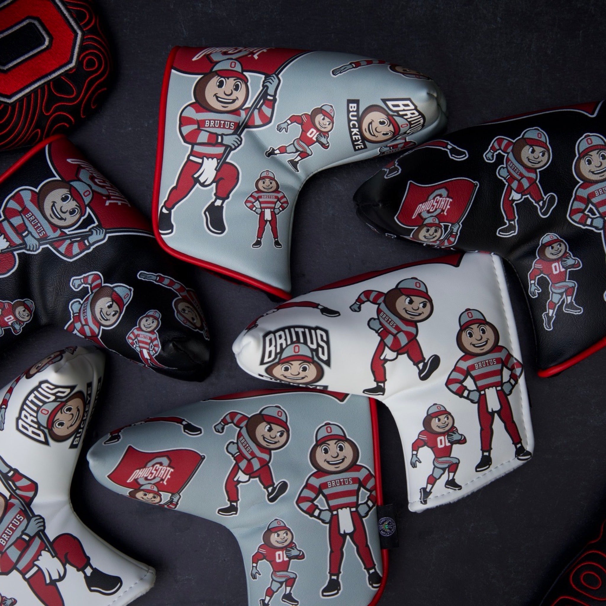 Ohio State Brutus Montage Blade Putter Headcover collection featuring black, gray, and white color options with multiple Brutus mascot illustrations.