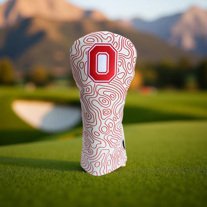Ohio State Block O white topography driver headcover displayed on a golf course green