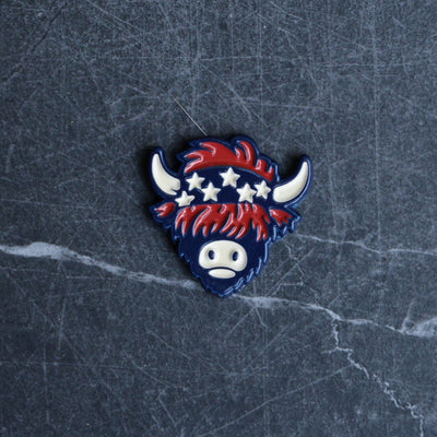 The Patriot Ball Marker featuring Americana bandana Looper artwork displayed on dark marble stone background