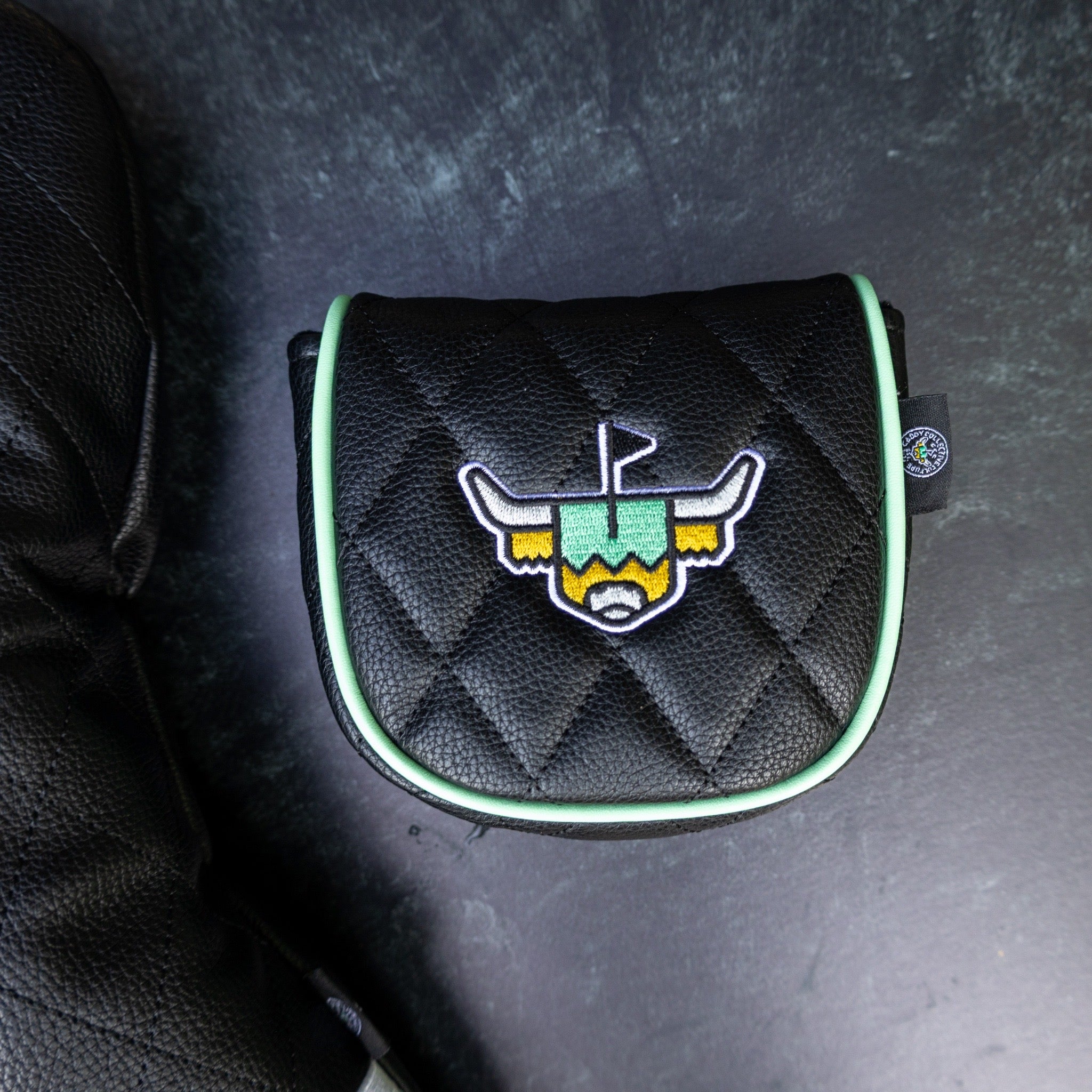 Quilted Heritage Leather Center Shaft Mallet Putter Cover displayed with matching leather driver headcover, featuring black quilted leather and embroidered Looper logo.