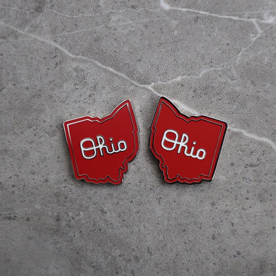 Script Ohio golf ball marker pair showing detailed enamel and magnetic finish