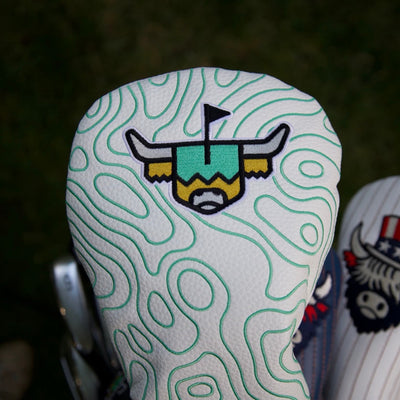 Terrain Driver Headcover displayed on a golf bag during a round, featuring embroidered topographic detailing.