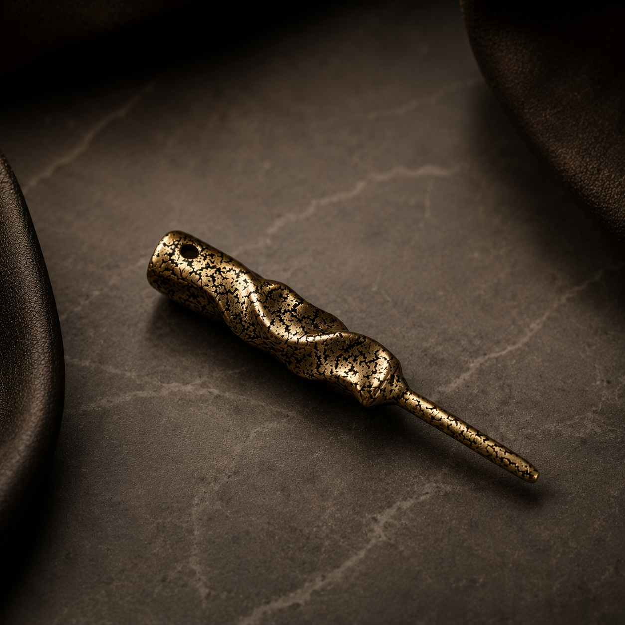 Caddy Collective Culture Twisted Metal divot tool in Forged Gold finish featuring hand-forged texture and black gold metallic detailing on luxury surface.